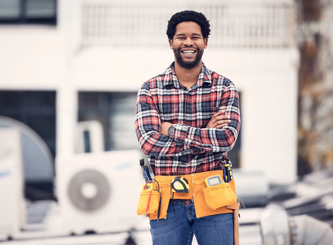 HVAC contractor standing proudly