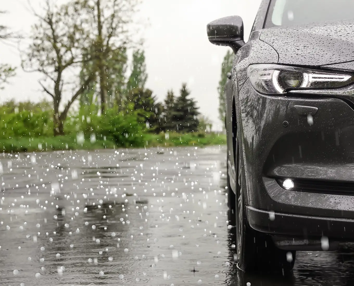 car parked outside during a hail storm
