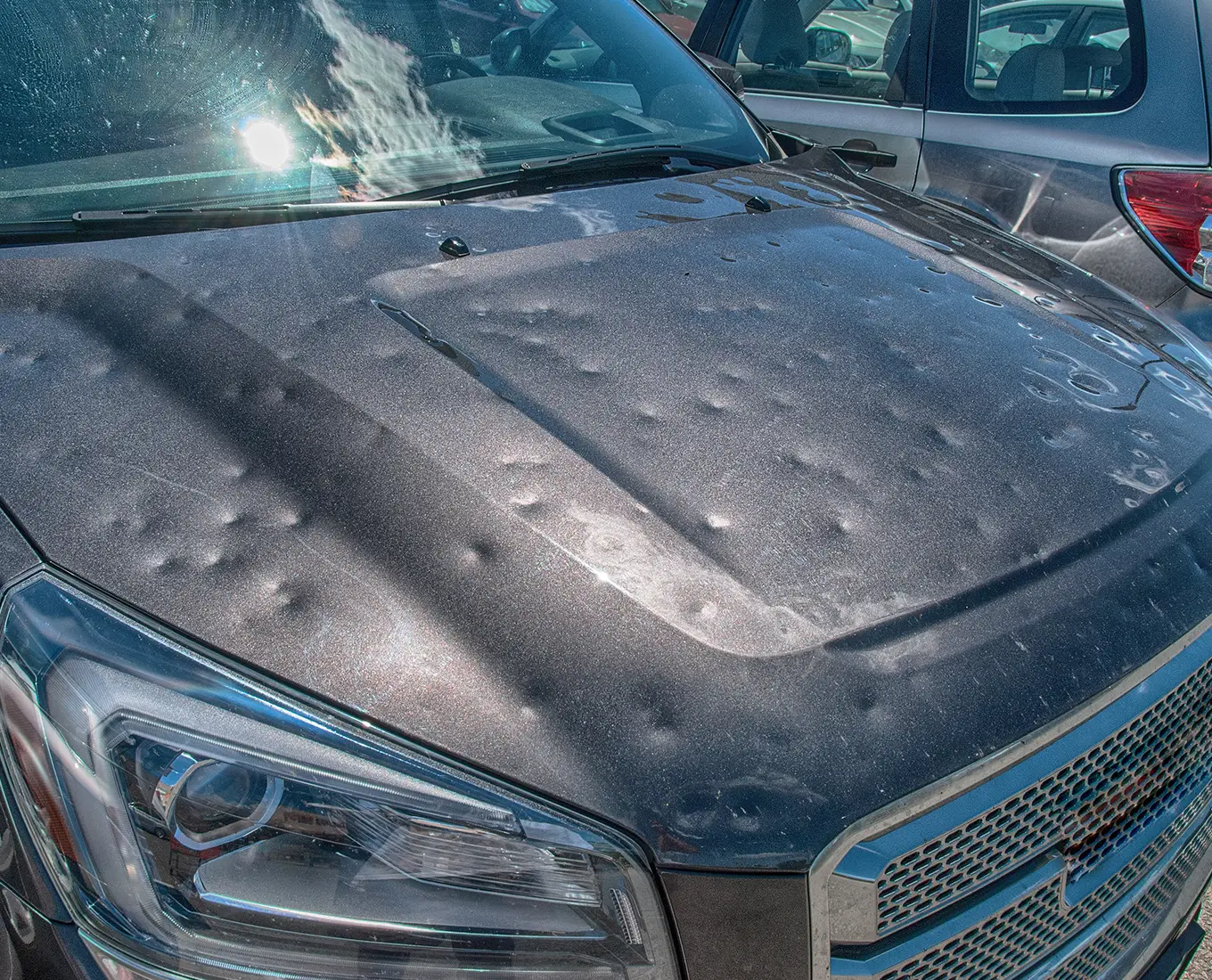 car impacted by hail storm and will require hail damage repair services